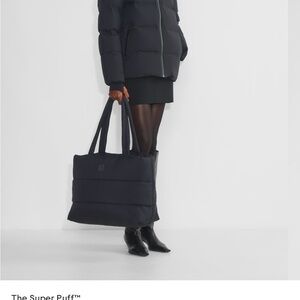 Aritzia Black Travel Tote Bag with Classic Shape and Sturdy Handles